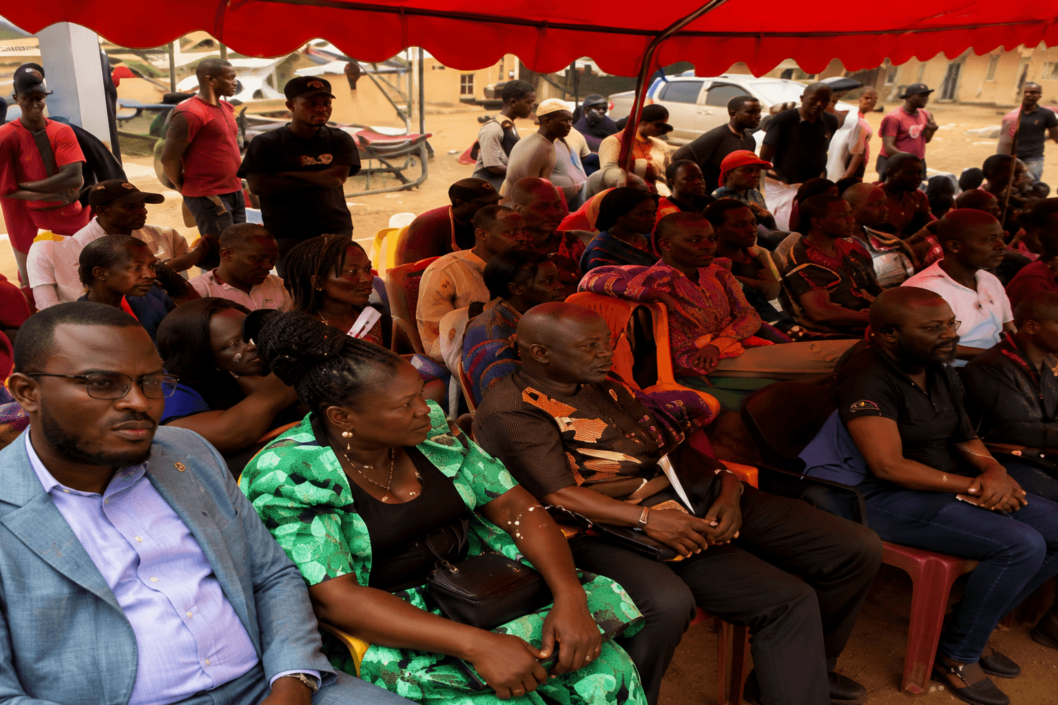 Community members of Oldest Congo Town gathered at an outdoor town meeting